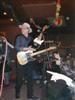 Webb presents a guitar to a retiring Chicago employee.